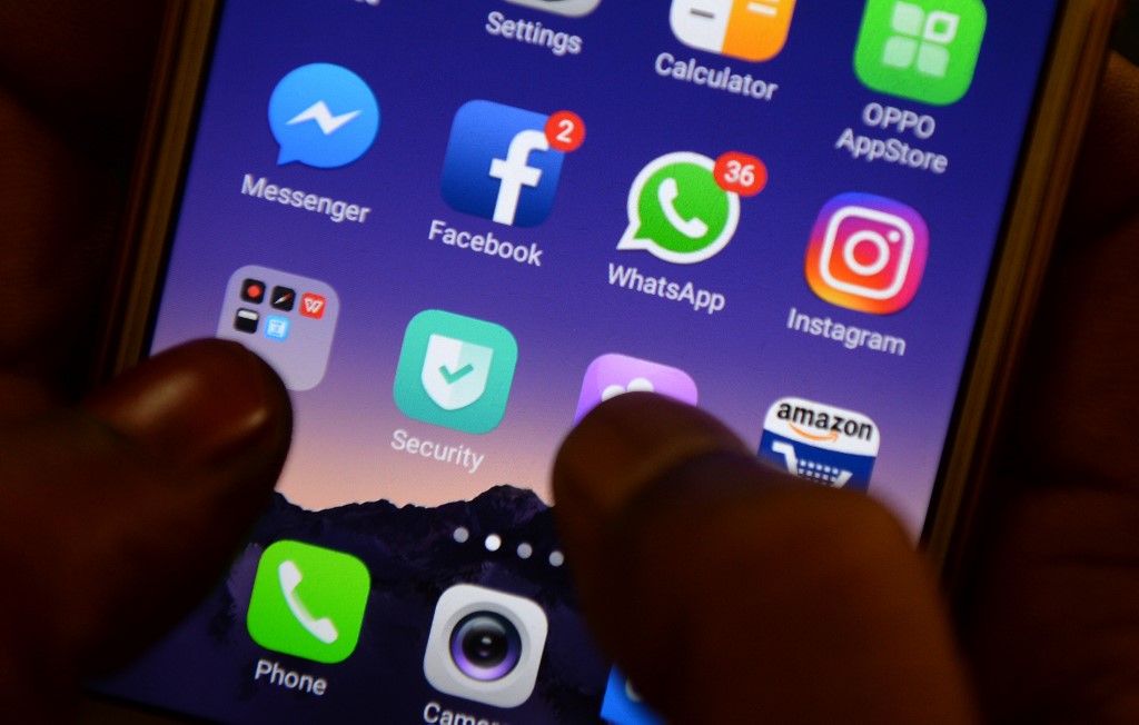 his photo illustration taken on March 22, 2018 shows apps for Facebook, Instagram, Whatsapp and other social networks on a smartphone. (Arun Sankar / AFP)