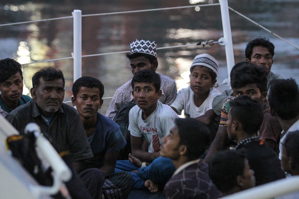 Rohingya refugees detained in Malaysia territorial waters off the island of Langkawi arrive at a jetty in Kuala Kedah, northern Malaysia on April 3, 2018. (AFP)