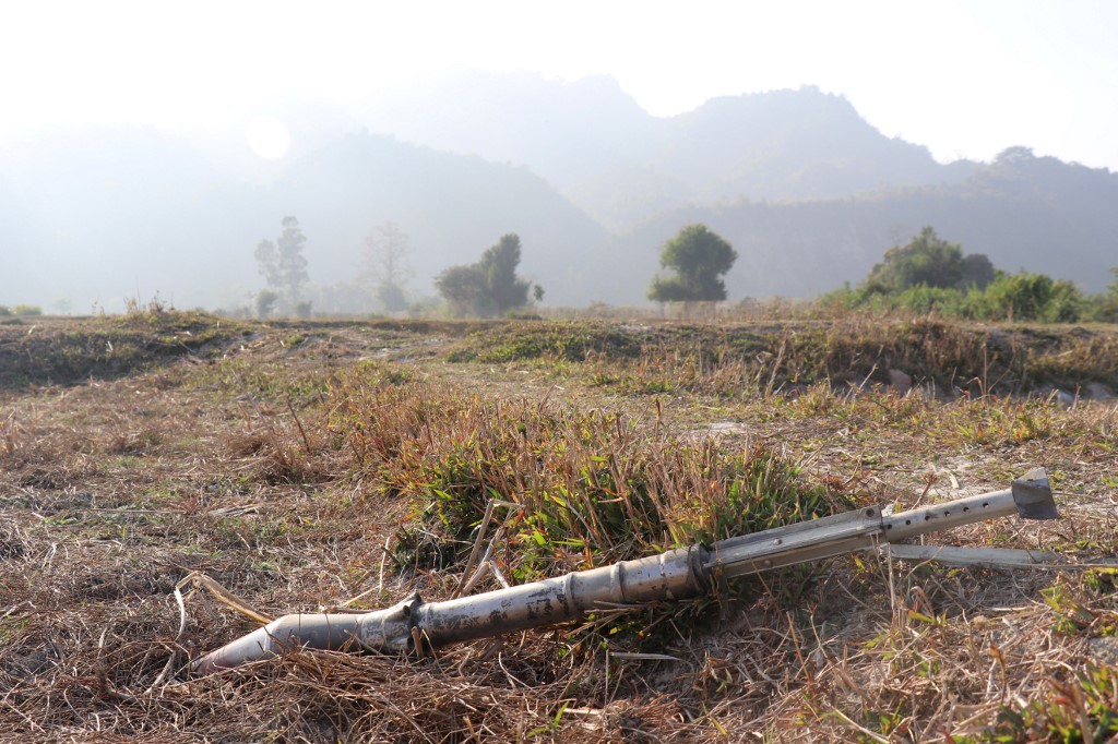 This photo taken on February 21, 2019 shows an unexploded ammunition lying on a field in Rathedaung township after fresh fighting in Rakhine state between the Myanmar military and the Arakan Army, an ethnic Rakhine force. (AFP)