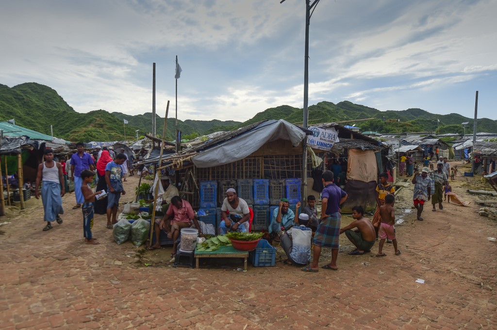 A Rohingya man sells betel leaves in a market at a camp in Teknaf on August 21, 2019. (Munir Uz Zaman / AFP)