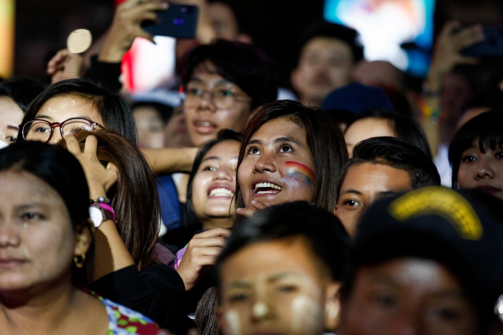 People watch the Pride festival in Yangon on January 26. (Sai Aung Main / AFP)