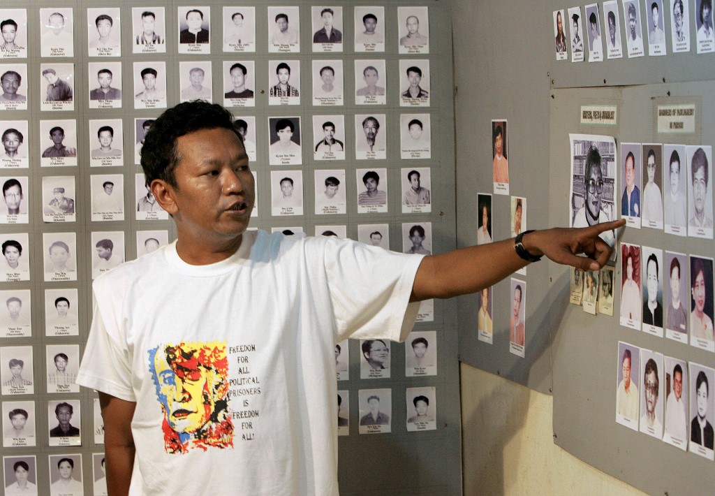 In this file photo taken on September 26, 2007, former political prisoner Bo Kyi talks about photos of other prisoners from the 1988 Myanmar uprising at a small museum in Mae Sot, near the Thai-Myanmar border. (Pornchai Kittiwongsakul / AFP)