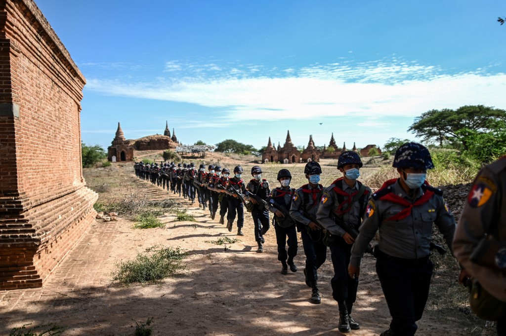 This photo taken on June 23, 2020 shows members of a police squad patrolling pagodas in a temple complex in Bagan, Mandalay Region. (Ye Aung Thu / AFP)