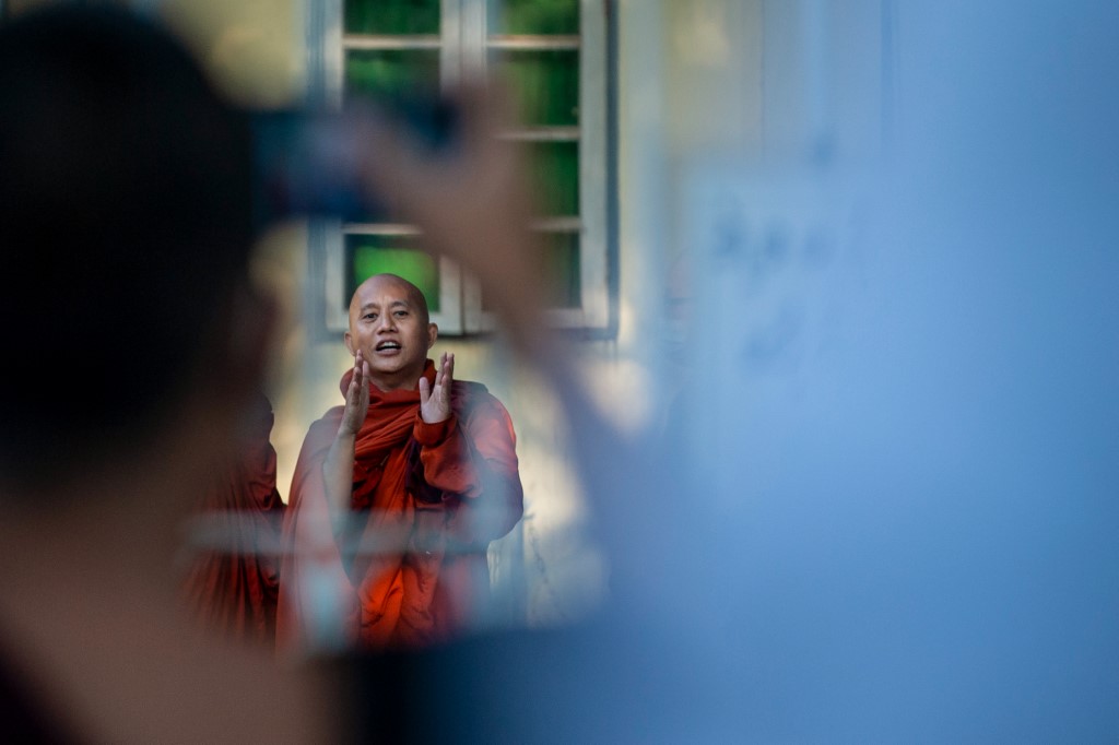 Buddhist monk Wirathu talks to his followers before turning himself in at a Yangon police station on November 2, 2020. (Sai Aung Main / AFP)