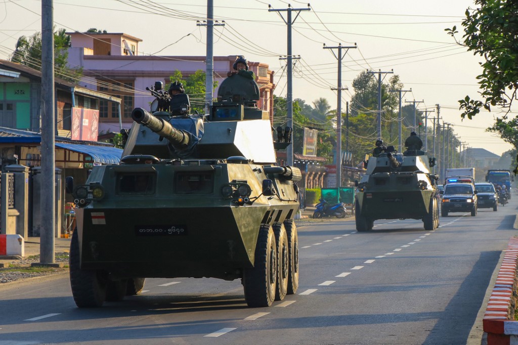 Soldiers ride in military armoured vehicles in Myitkyina, Kachin state on February 3, 2021, as Myanmar's ousted leader Aung San Suu Kyi was formally charged on Wednesday two days after she was detained in a military coup. (STR / AFP)