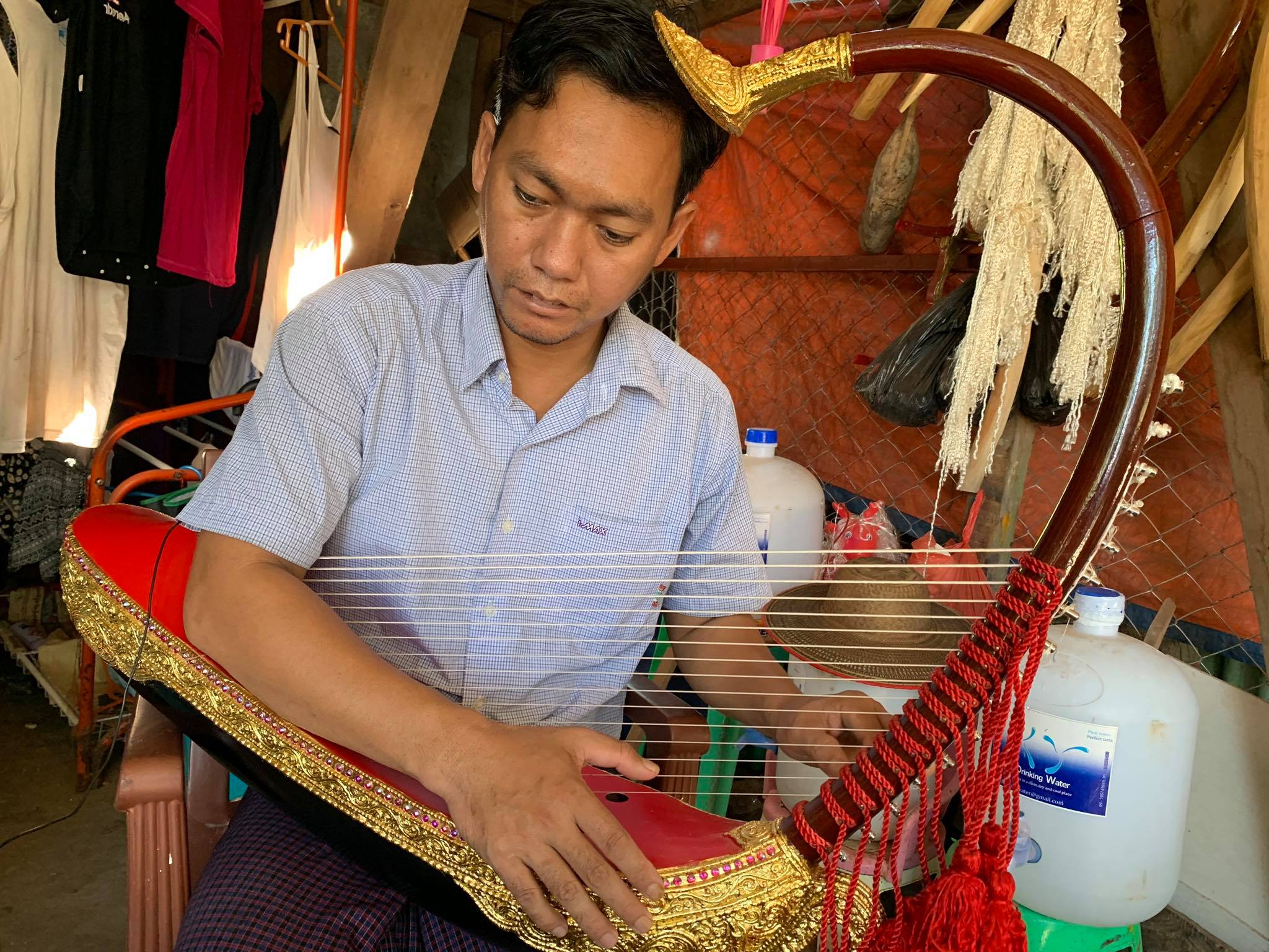 Aye Aung Win, who works in North Okkalapa township, began learning to make traditional Burmese harps when he was in fourth grade. (Photos and video by Nay Chi Nway) 