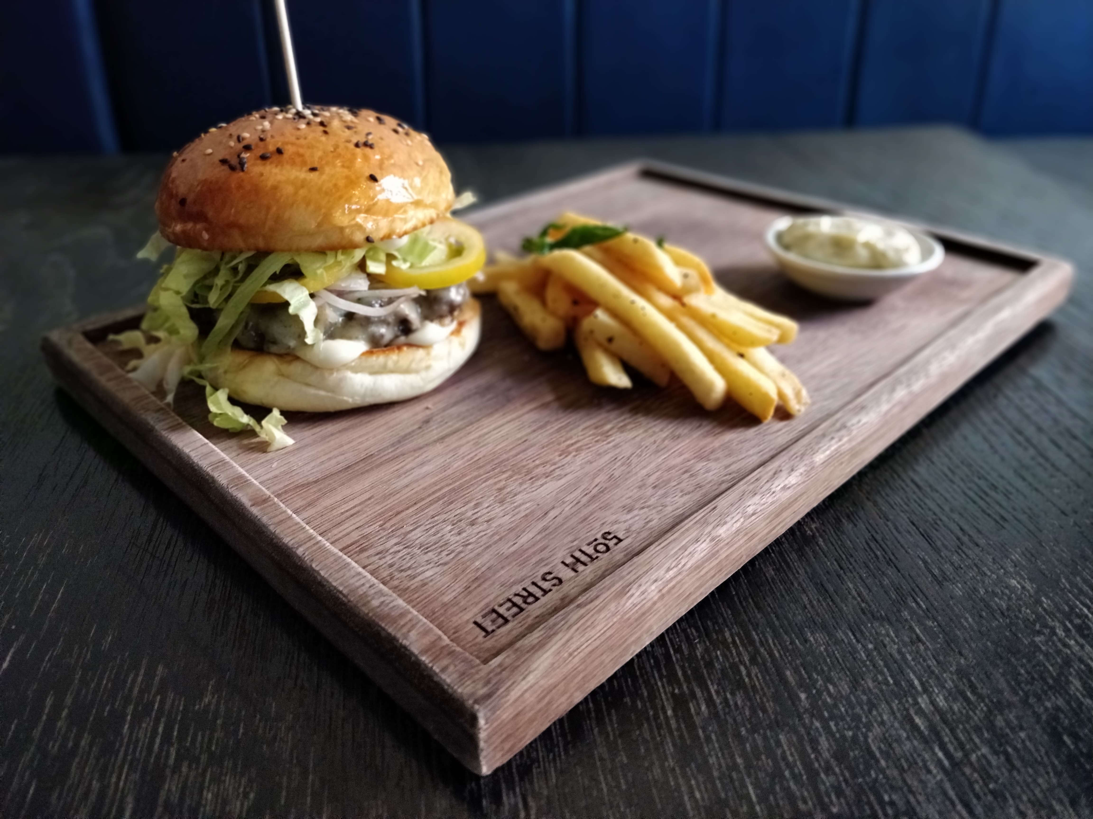 The 50th Street Bar Burger is a sample of the pub grub offered in the Yangon favourite. (Photos by Iryna Kyrylenko / Myanmar Mix)