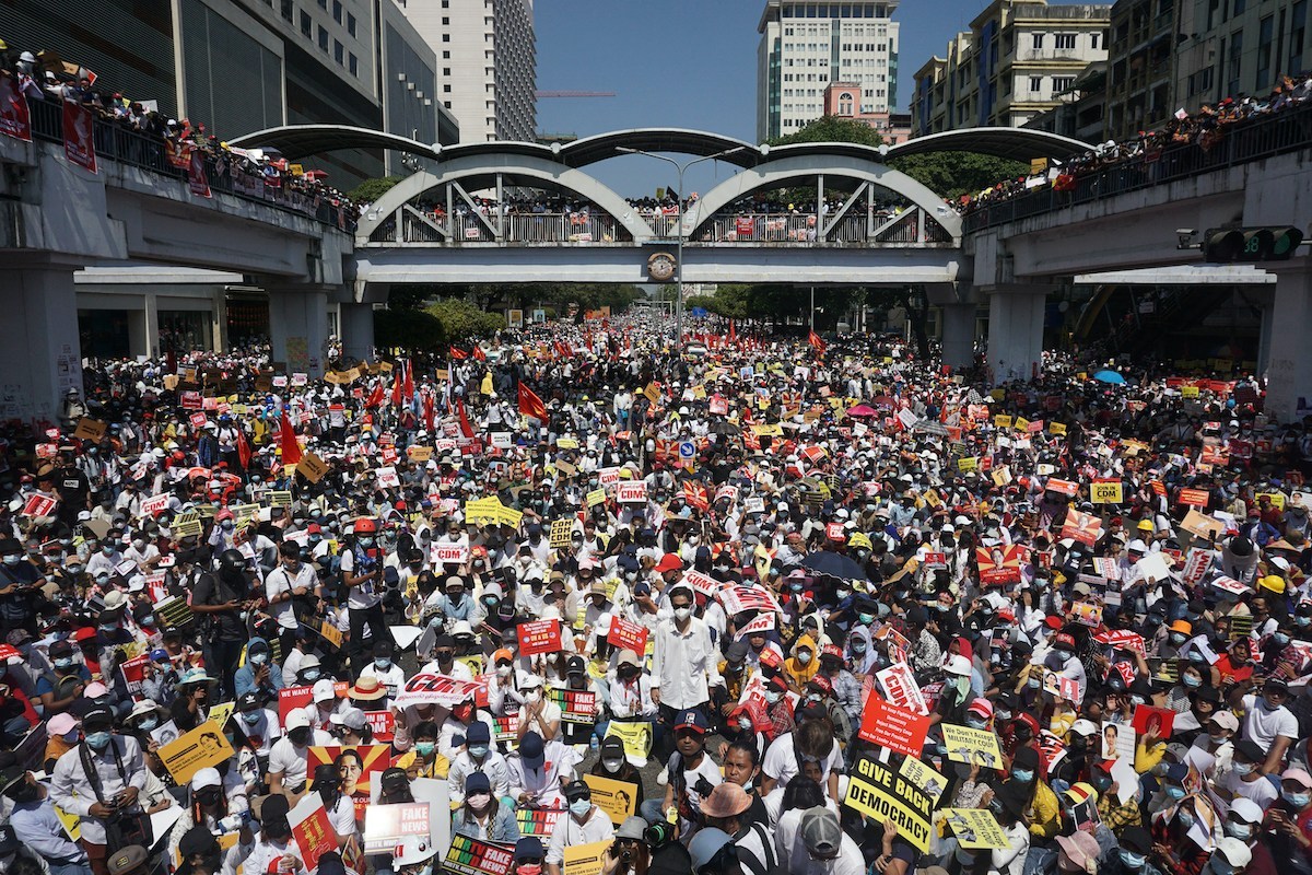 Protesters block a major road during a demonstration against the military coup in Yangon on February 17, 2021. (Sai Aung Main / AFP)