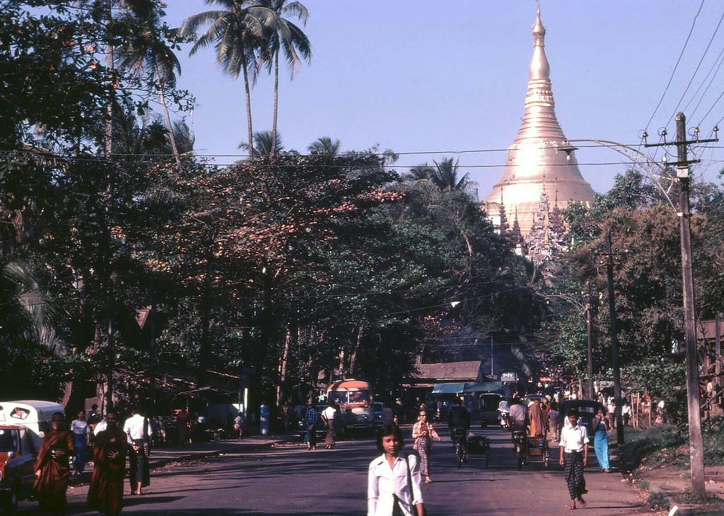 Yangonites go about their daily business, with Shwedagon pagoda in the background. (Peter Ward)