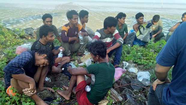 A group of Rohingya at Sungai Baru Beach in Malaysia’s Perlis state after they arrived by boat in this undated handout photo released April 8, 2019. (Royal Malaysia Police)