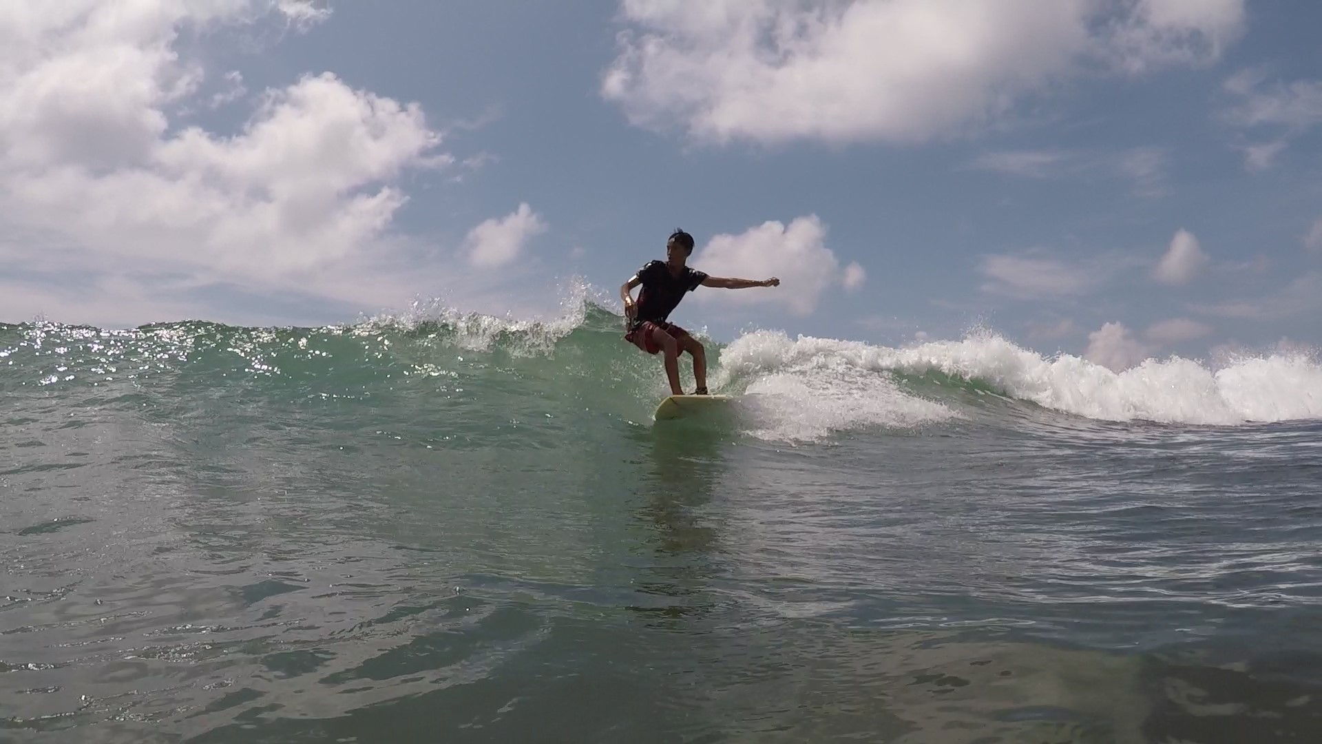 Local surfer Lwin Ko Ko Htet rides a wave on a beach near Ngwe Saung. (Csiga Balazs)