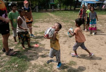 Players from the Little Dragons rugby team taking part in a training session in the North Dagon township, located on the outskirts of Yangon. (Sai Aung Main / AFP)