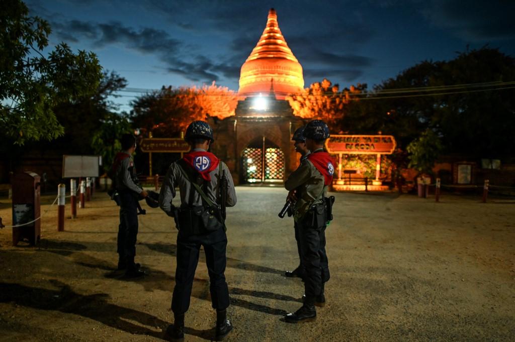 Members of a police squad stand outside a temple complex in Bagan, Mandalay Region. (Ye Aung Thu / AFP)