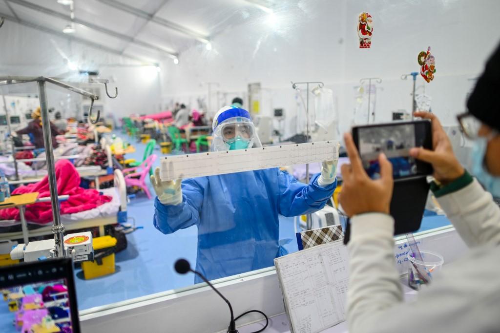 A doctor working in the intensive care unit (ICU) of the Ayeyarwady Covid Centre at the Wunna Theikdi Stadium in Mandalay.