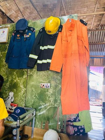 Win Kyi's firefighter gear at in his home in Kyeemindaing township.